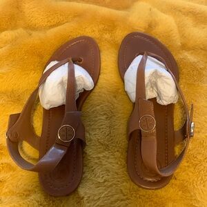 Tory Burch flat sandals. I wore them once so almost brand new.